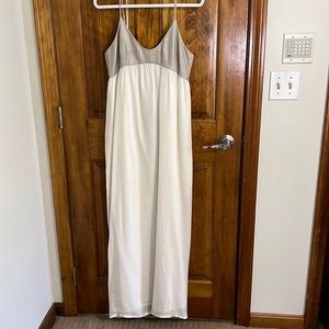 Gorgeous L’agence ivory silk long dress with silver metallic detail on the top.